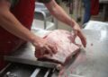 What is industrial meat and why is it considered harmful